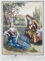 Eine Frau, die auf dem Gras sitzt